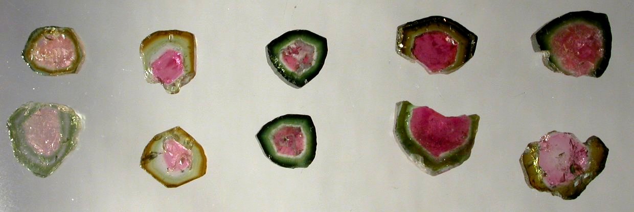 Watermelon Tourmaline polished slices matched pairs rubellite, indicolite bi-color, watermellon Elbaite, Schorl, Buergerite, Dravite, Chromdravite, Uvite,   Tsilaisite, and Liddiocoatite, Cats-eye Paraiba crystals gems contemporary metaphysical new age Mystic Merchant