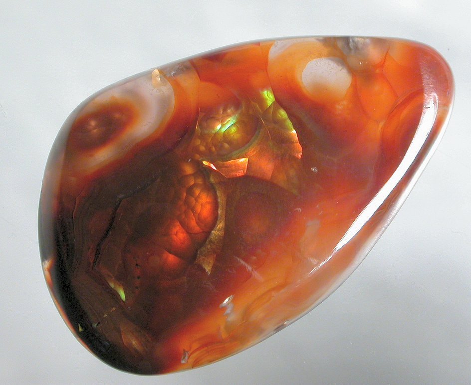 Purple Fire Agate gems stones gallery with pictures info faq about Fire Agates gems gallery cabs cabochons custom Fire Agate jewelry fire agate cabs cabochons metaphysical new age fire agate uses