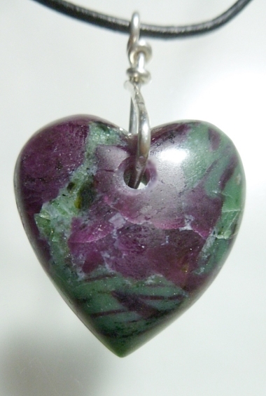 Carved Ruby crystal in zoisite healing heart talisman. Hand carved by Mystic Merchant - Billy Mason Hearts carved hand carved gemstone Hearts agate tourmaline quartz ruby in zoisite crazy lace agate crystals sugilite moldavite pietersite obsidian opall