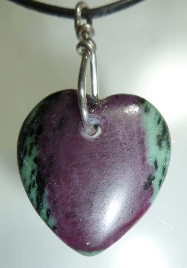 Carved Ruby in zoisite healing heart talisman. Hand carved by Mystic Merchant - Billy Mason Hearts carved hand carved gemstone Hearts agate tourmaline quartz ruby in zoisite crazy lace agate crystals sugilite moldavite pietersite obsidian opall